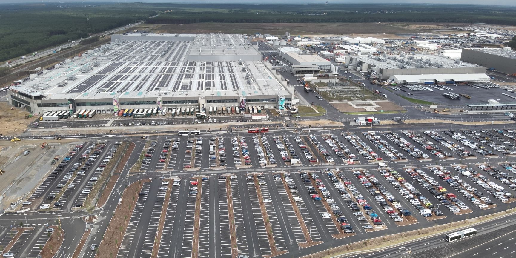Aerial view of the Tesla Gigafactory Berlin in Brandenburg, a sprawling, modern production and logistics center. Aerial view of the Tesla Gigafactory Berlin in Brandenburg, a sprawling, modern production and logistics center.